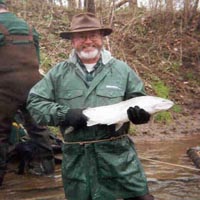 Stewart holding a salmon from Trail Creek in Northern Indiana